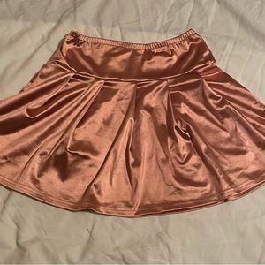 Pink pleated skirt better be